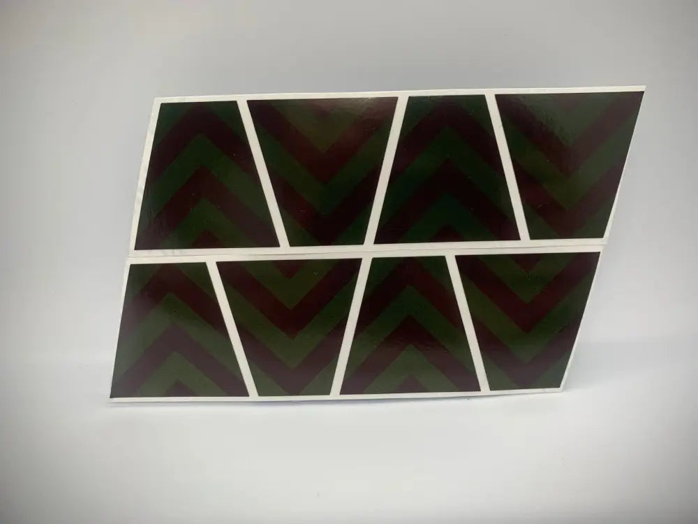 Eight black triangular panels with white borders for a Yellow Chevron Reflective Helmet